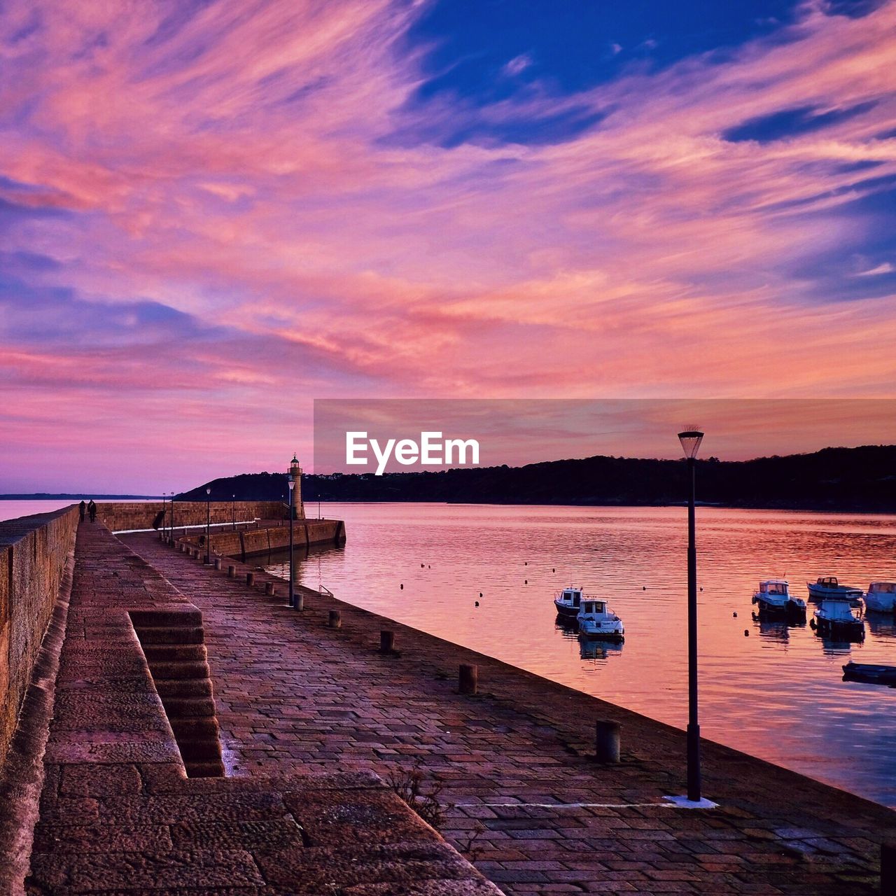 Scenic view of sea against dramatic sky