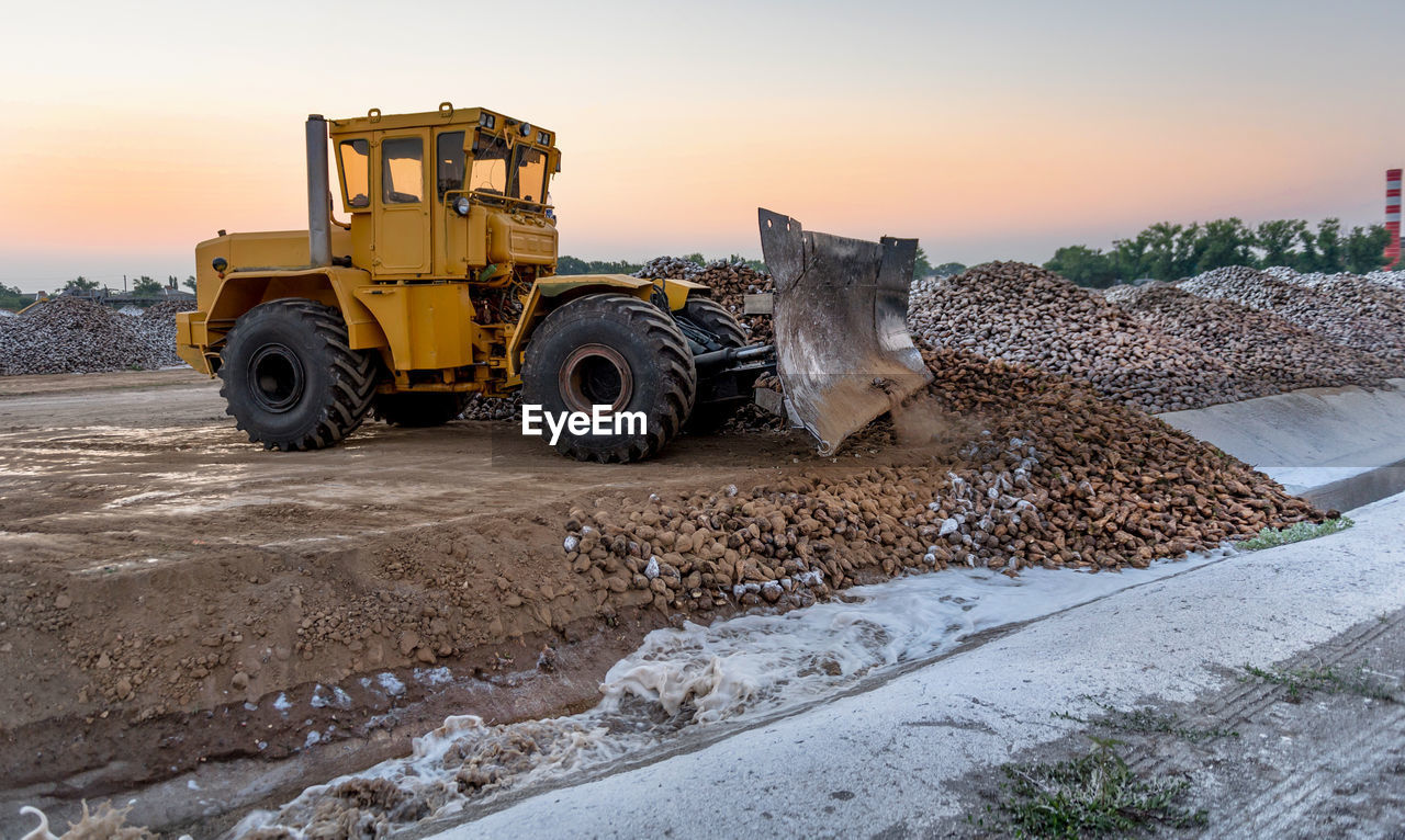 View of bulldozer at sunset