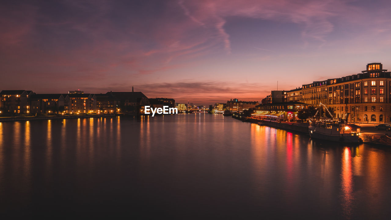 View of illuminated city at sunset