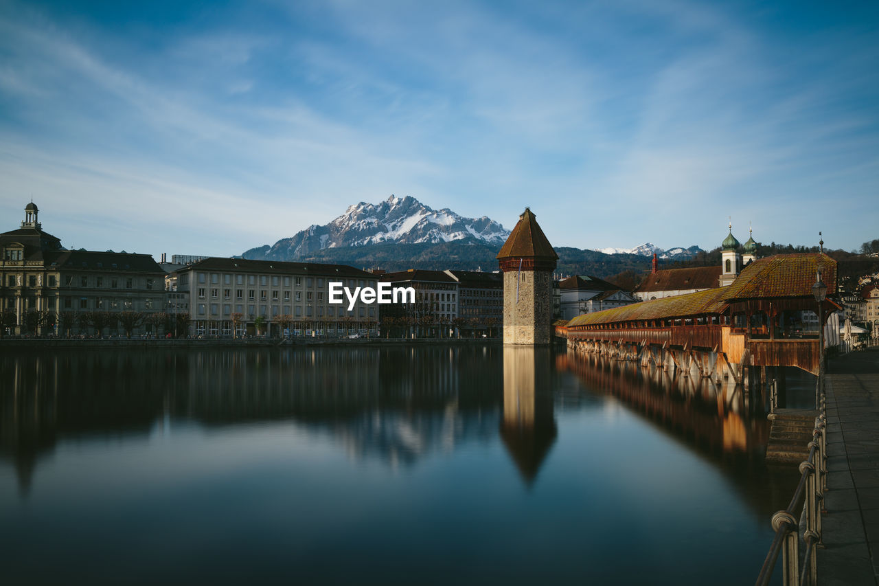 The chapel bridge in luzern city center, in the backgroud the alps.