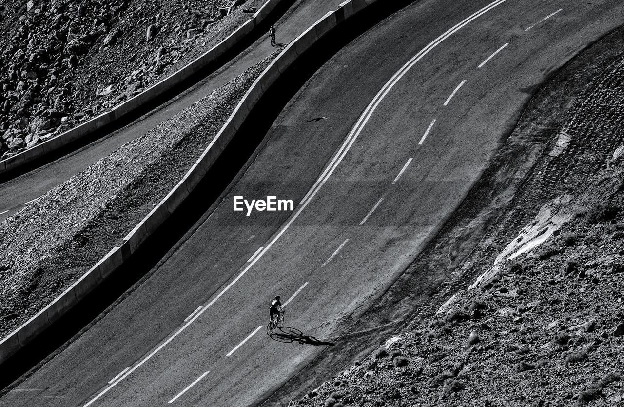 High angle view of person riding bicycle on road