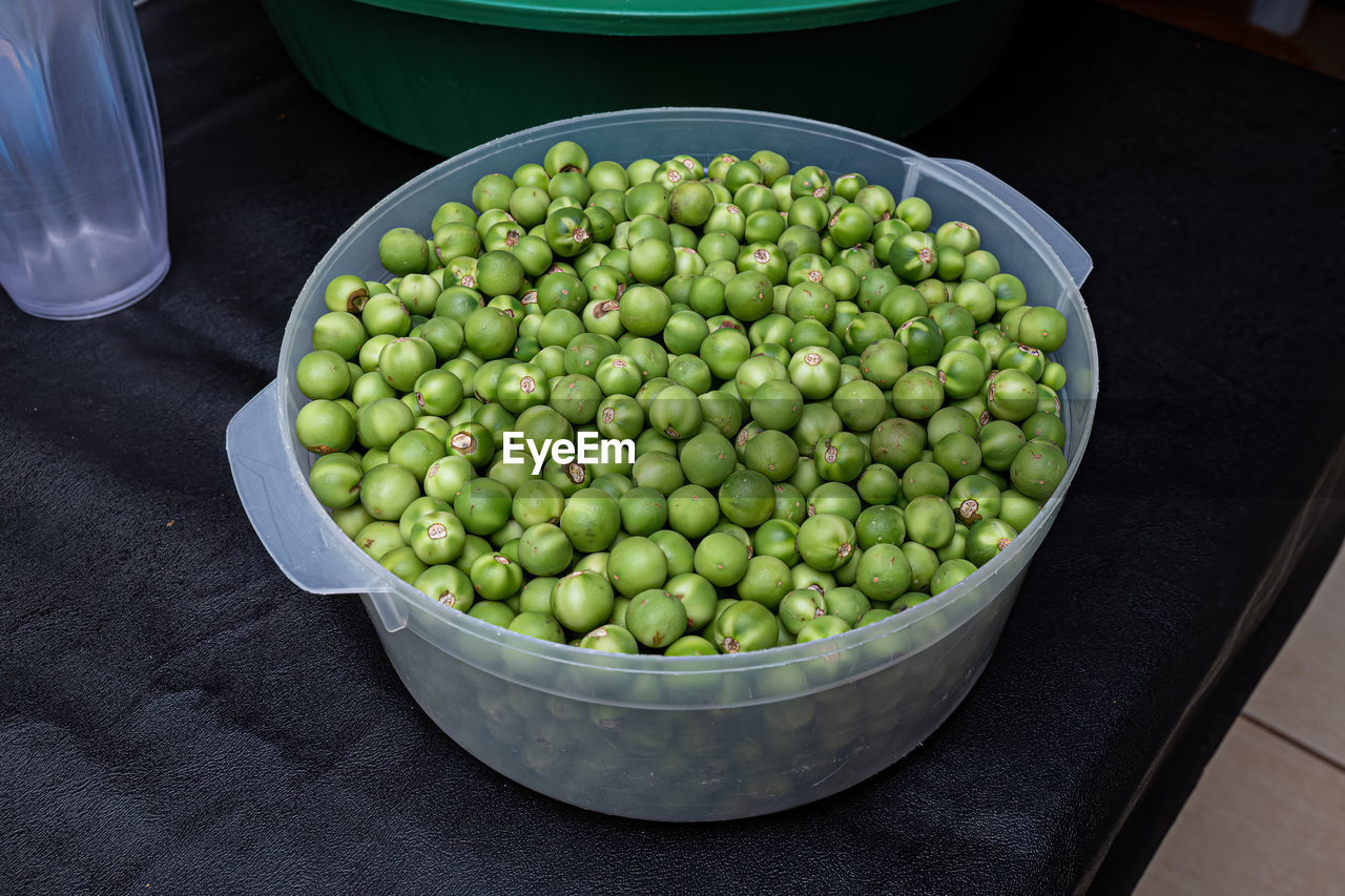 high angle view of green peas in container