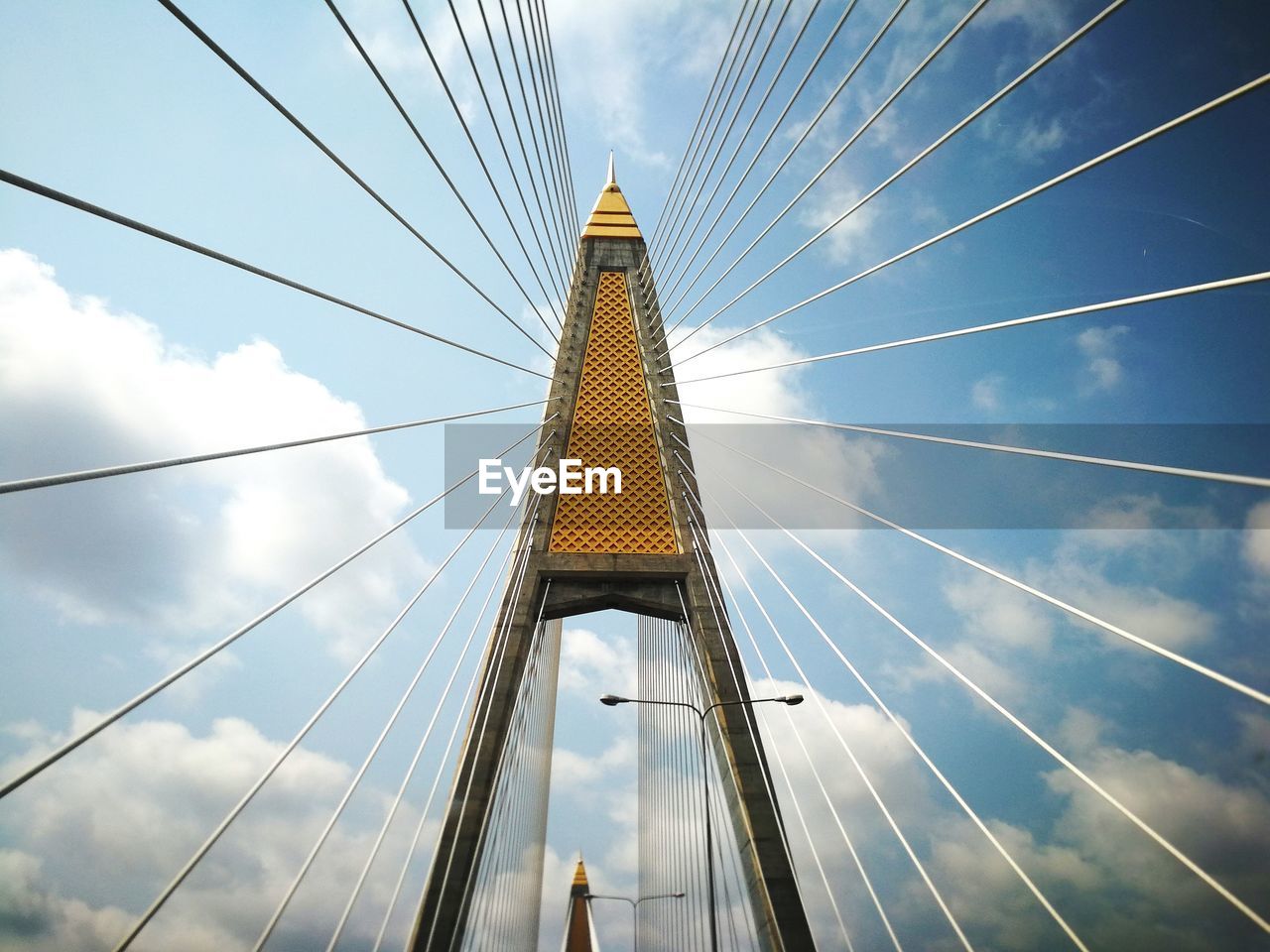 Low angle view of bridge against blue sky