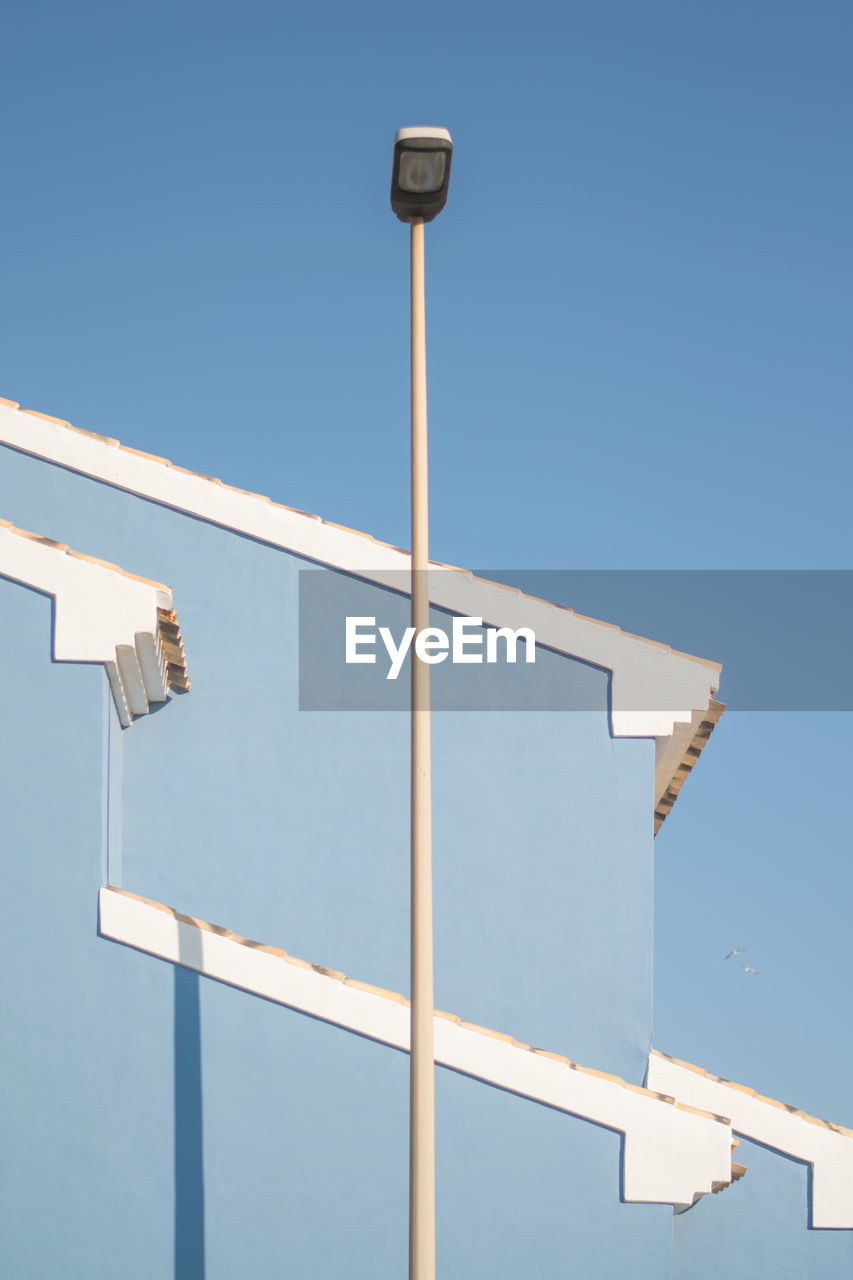 Low angle view of building against blue sky