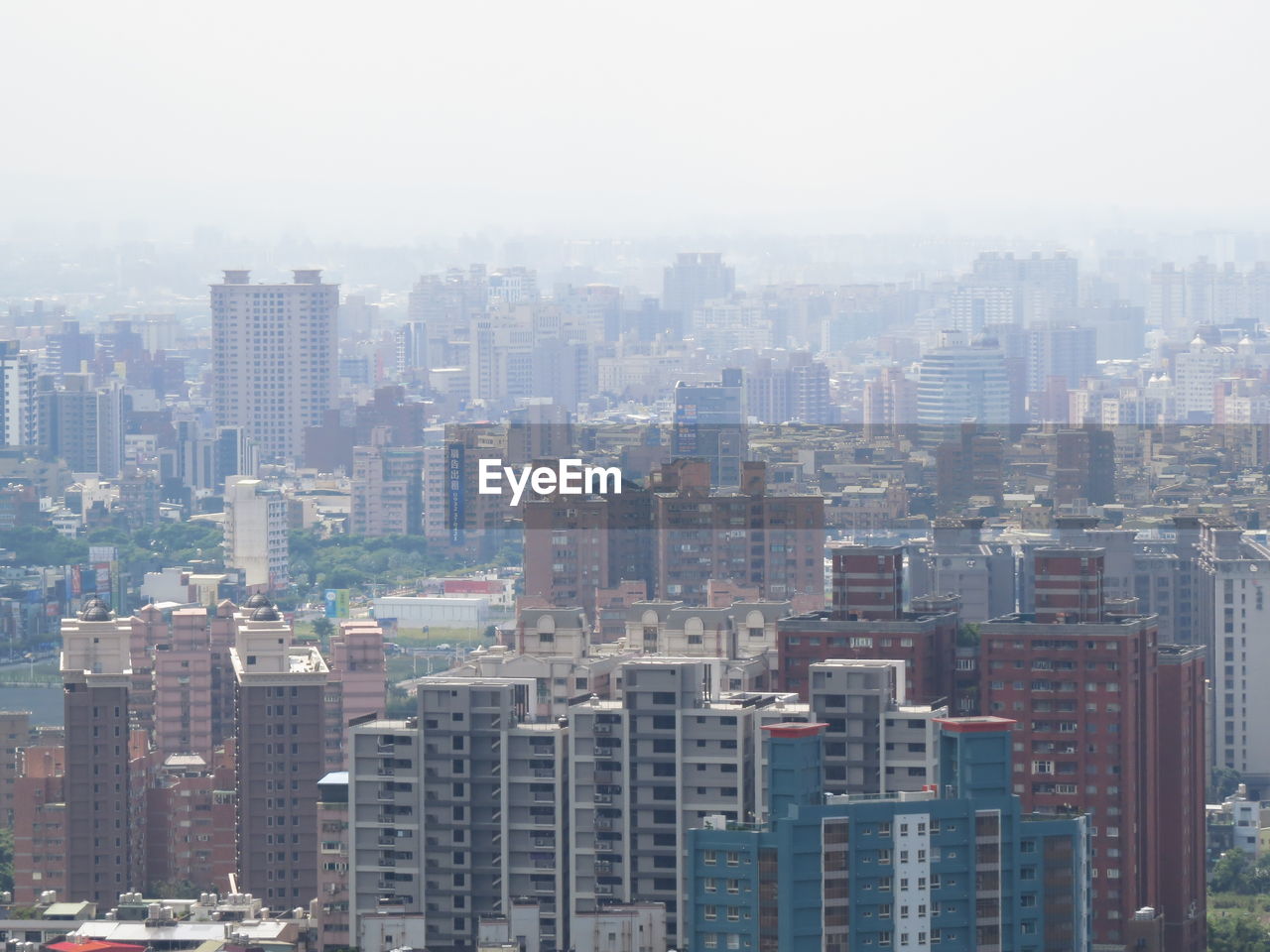 Aerial view of modern buildings in city against sky