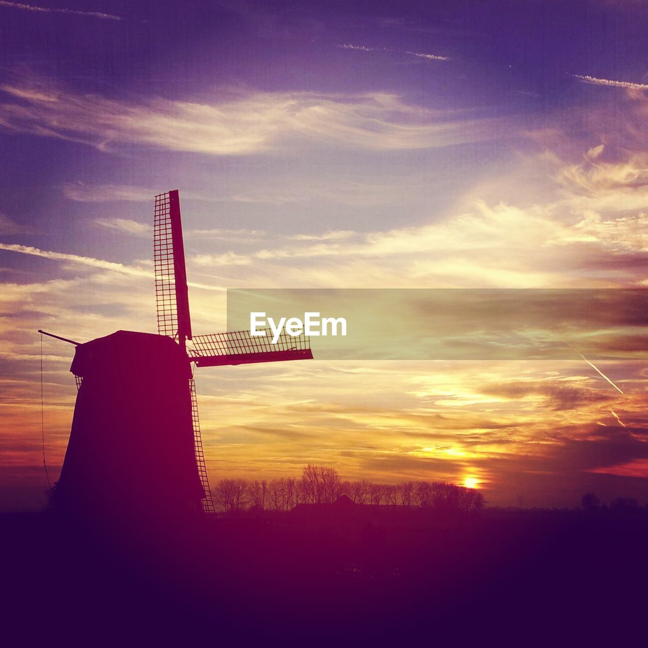 Traditional windmill during sunset