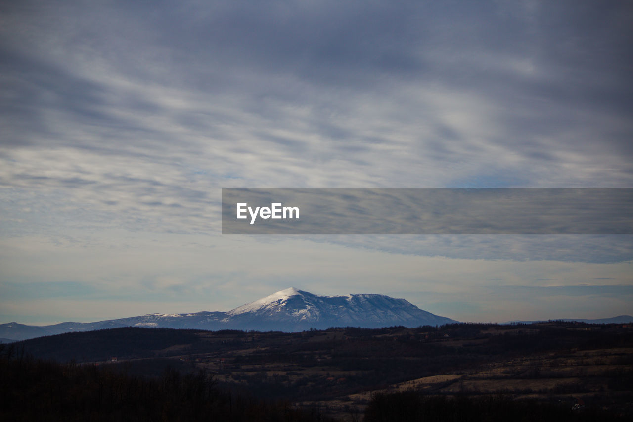 Scenic view of snowcapped mountains against sky