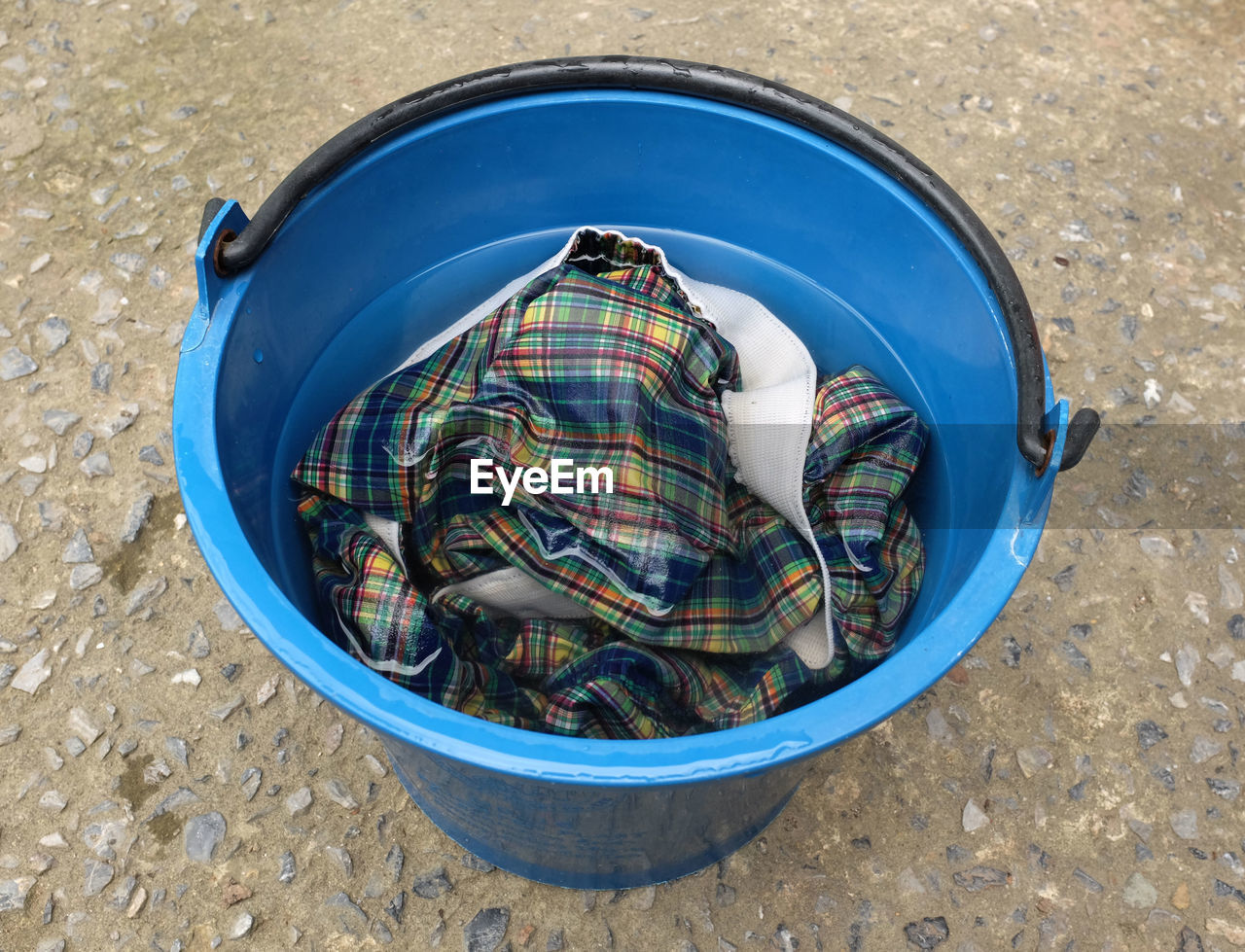 
clothes soaked in a tub for hand washing.