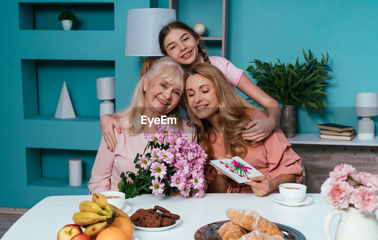 Portrait of cheerful family at home