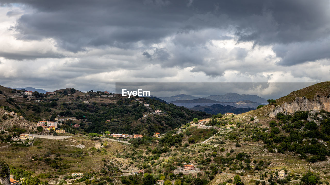 Panorama of the sicilian mountains under threatening clouds