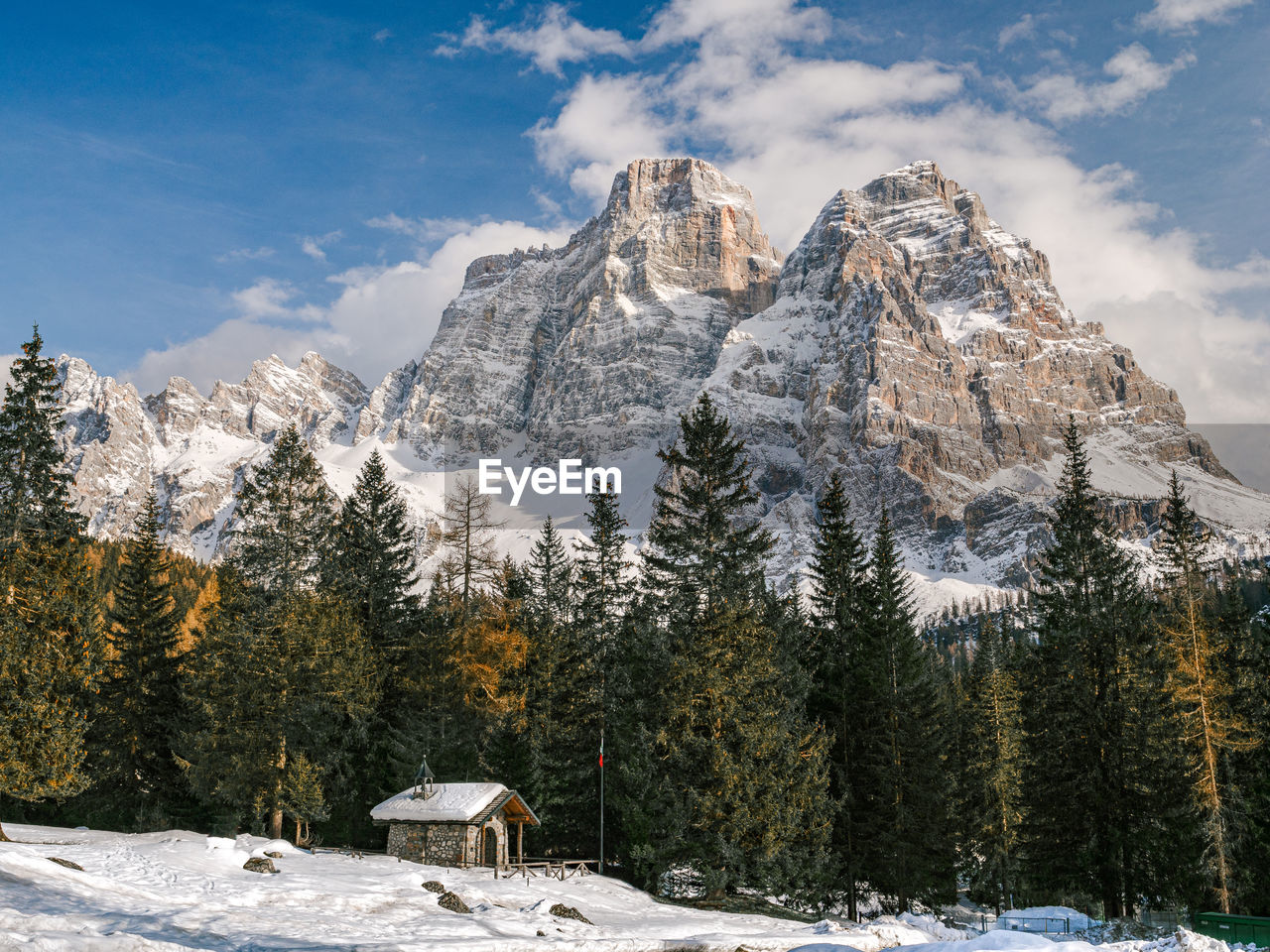 Scenic view of snow covered mountains against sky