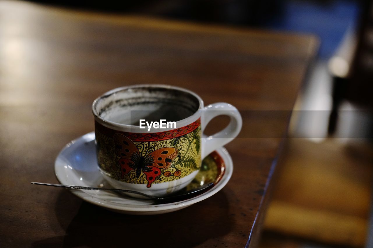 Close-up of coffee cup on table