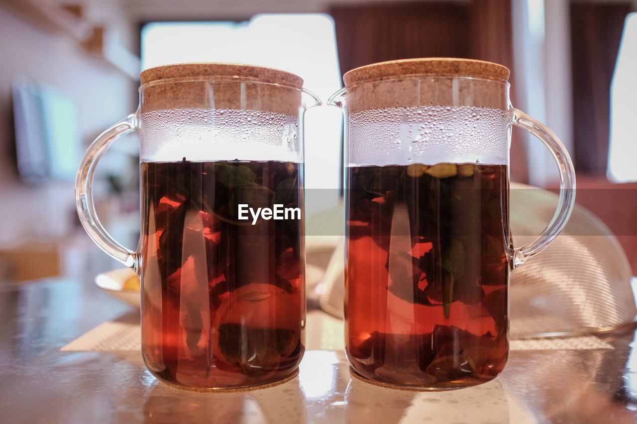 Close-up of hot tea glasses on table