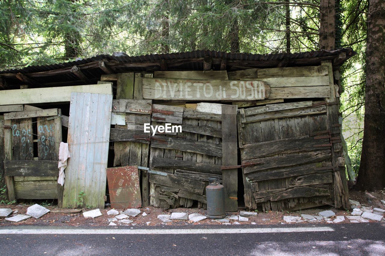 OLD ABANDONED HOUSE WITH TREES