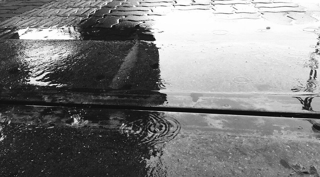 High angle view of wet footpath in rainy season