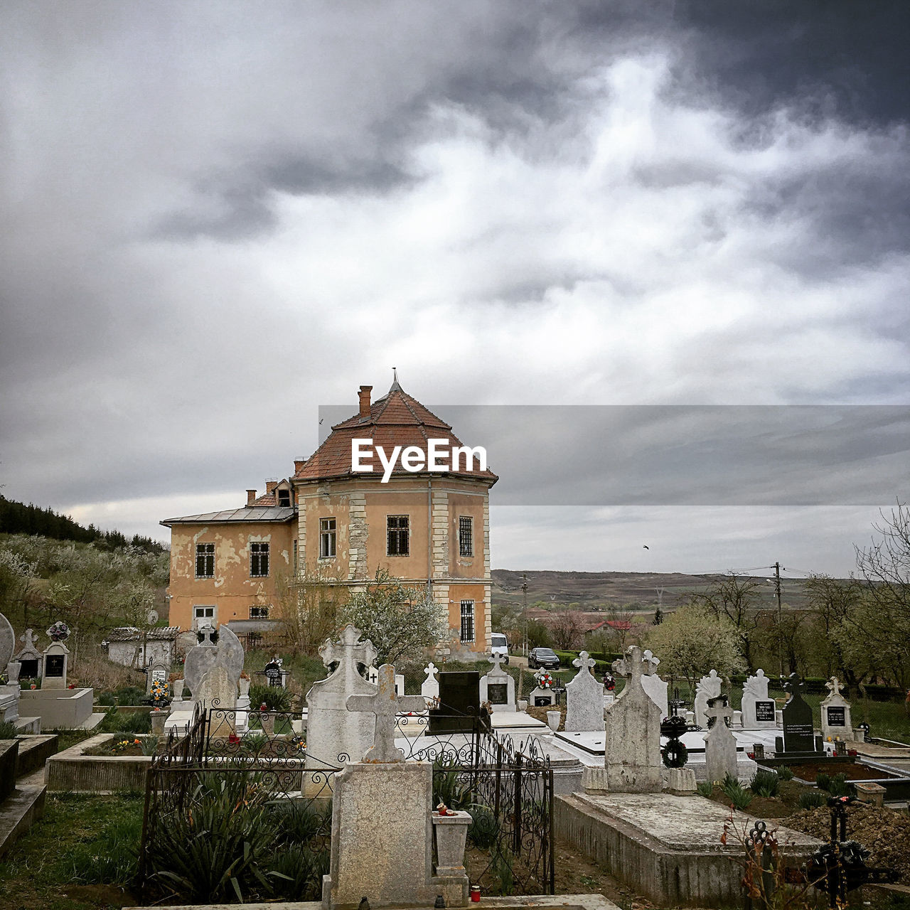 VIEW OF CEMETERY AGAINST BUILDING