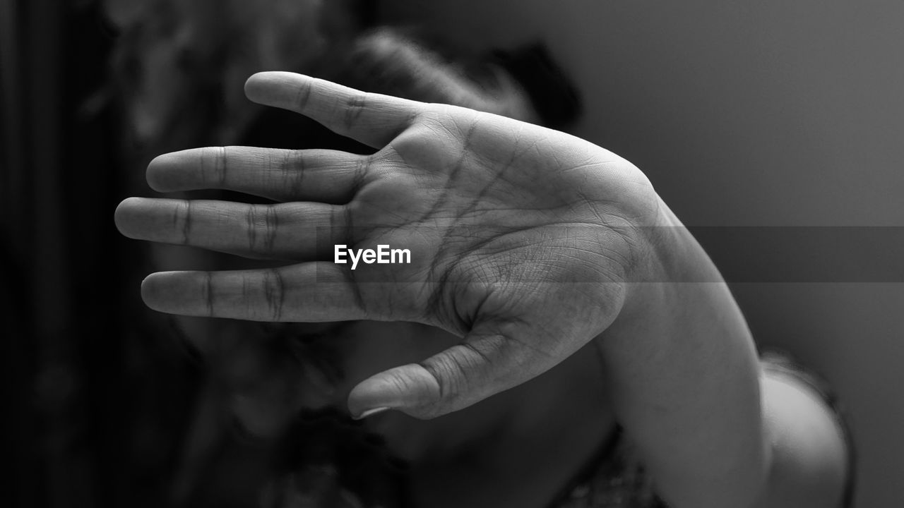 Close-up of woman showing stop gesture