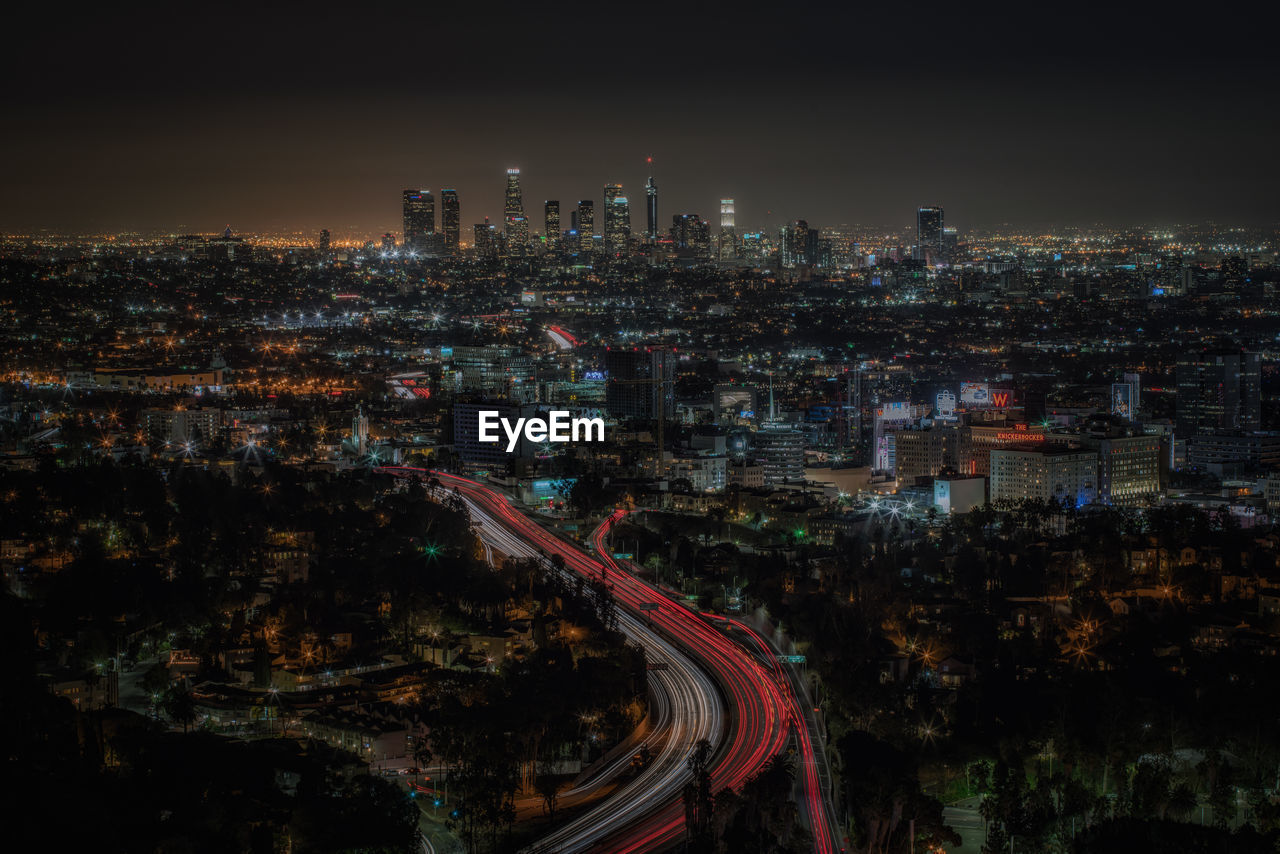 High angle view of illuminated cityscape at night