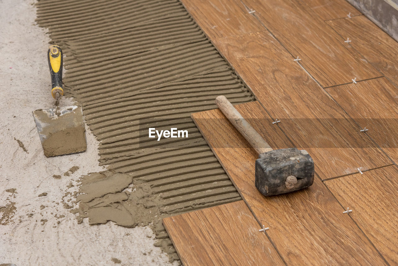 Ceramic tiles and tools for tiler. floor tiles installation.