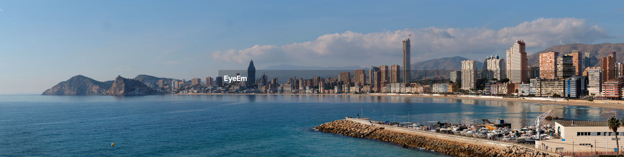 PANORAMIC VIEW OF SEA AND CITY AGAINST SKY