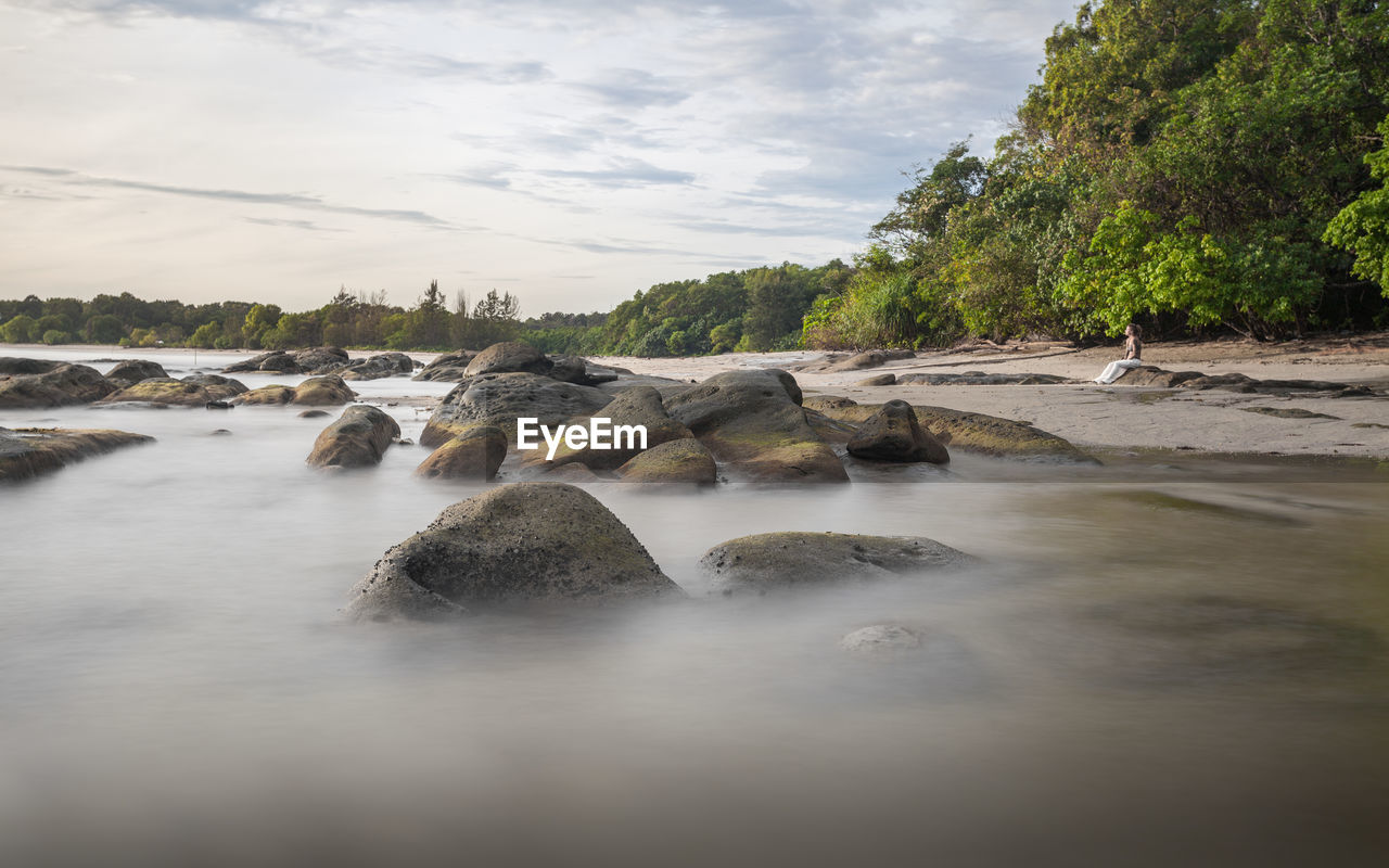 Long exposure capture of coast and ocean on borneo, sabah - malaysia
