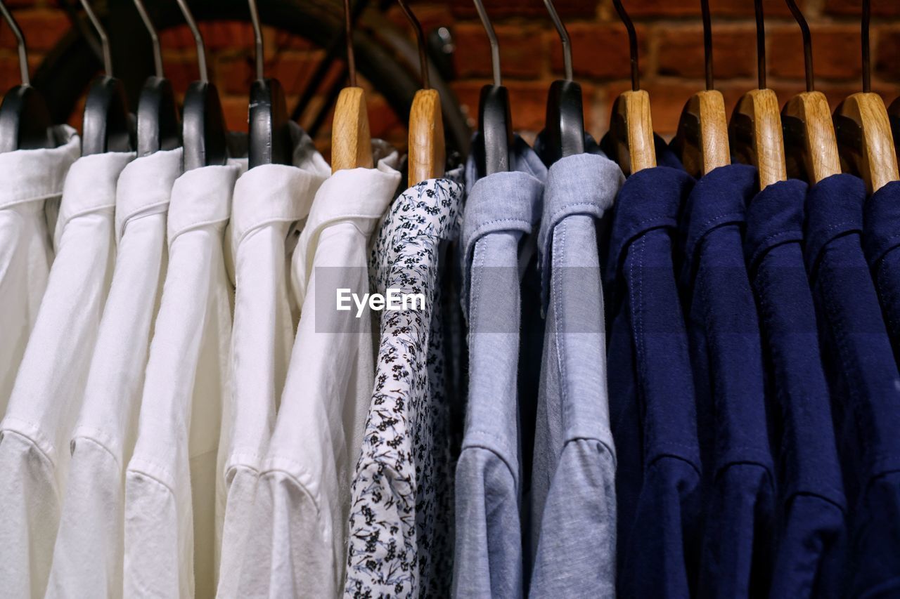 Close-up of shirts hanging at store