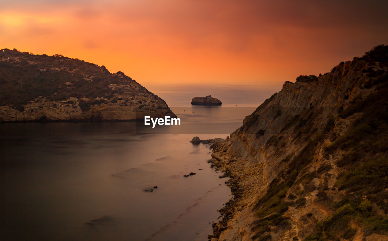 Scenic view of sea against sky during sunset