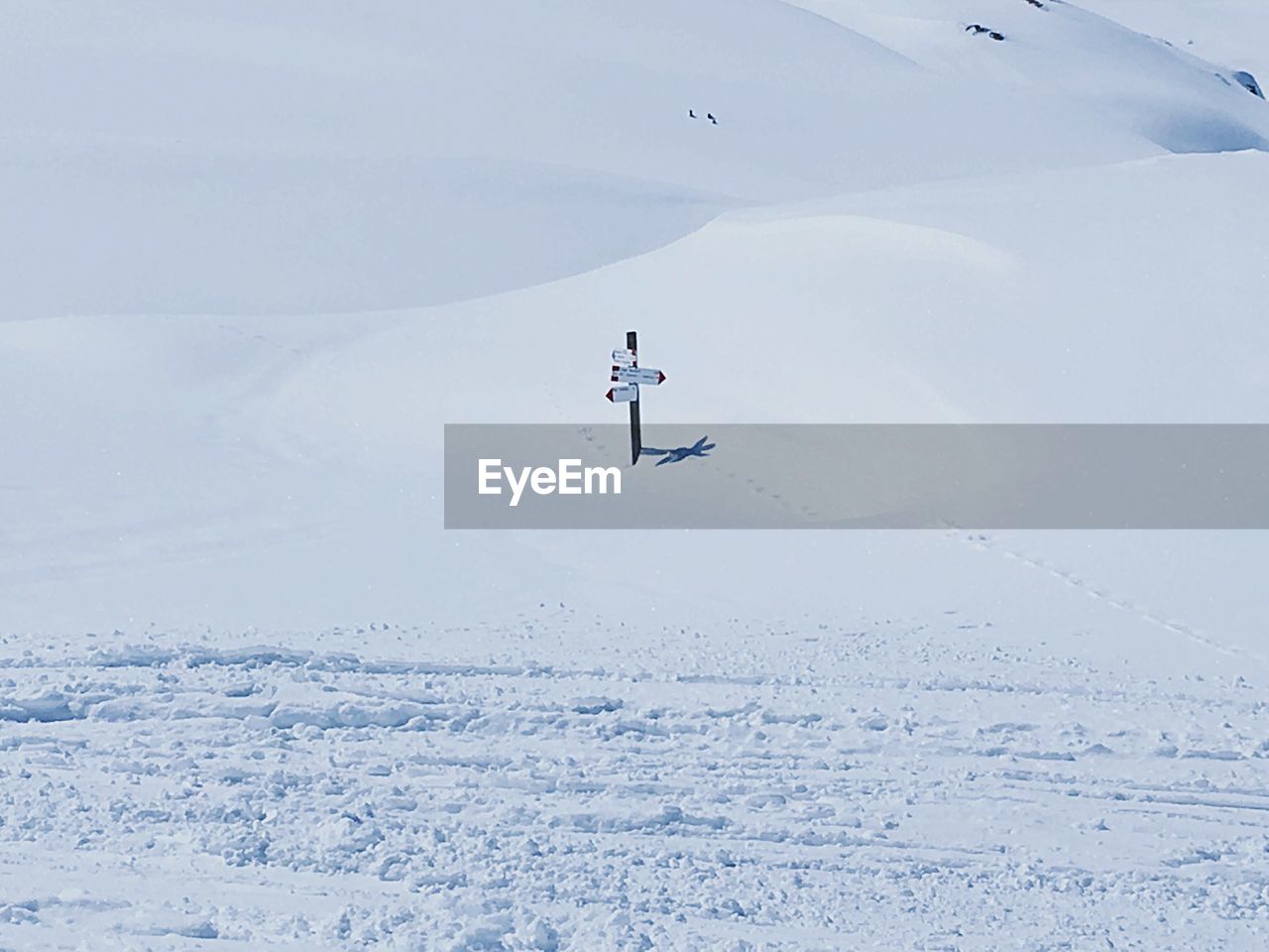 Information sign on snow covered landscape