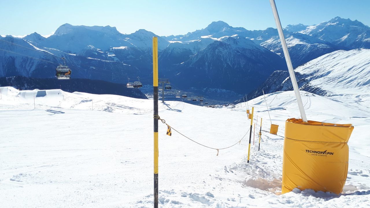 snow, cold temperature, mountain, winter, mountain range, environment, scenics - nature, landscape, nature, beauty in nature, snowcapped mountain, ski equipment, piste, no people, ski, tranquil scene, day, tranquility, land, sky, outdoors, sunlight, travel, vacation, white, travel destinations, non-urban scene, holiday, sports, frozen, winter sports, mountain peak, trip, ski mountaineering, pole, blue