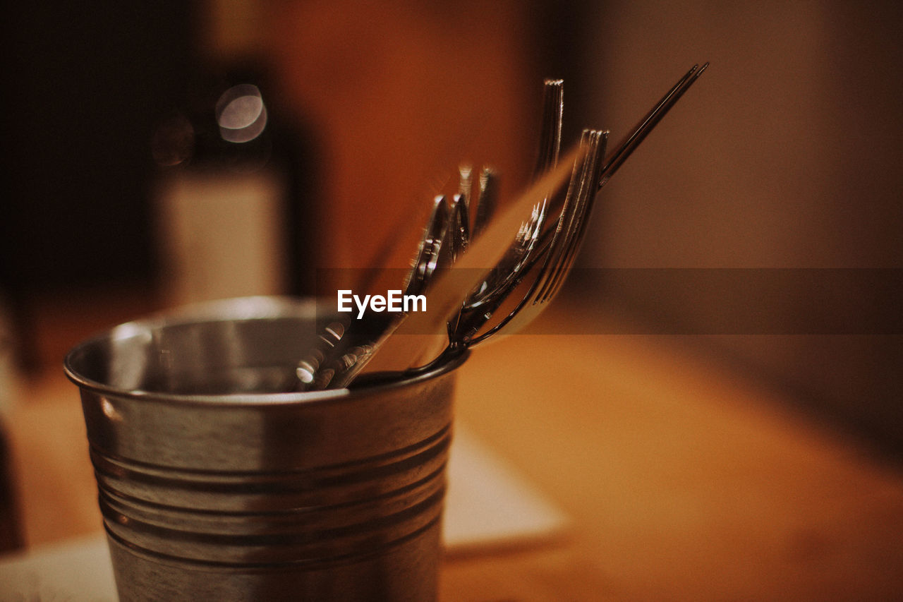 Close-up of fork in bowl on table