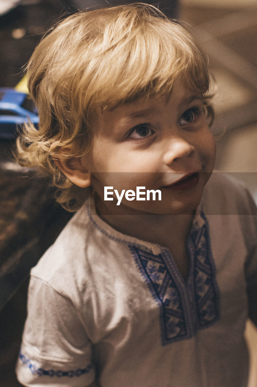 Portrait of cute boy looking away