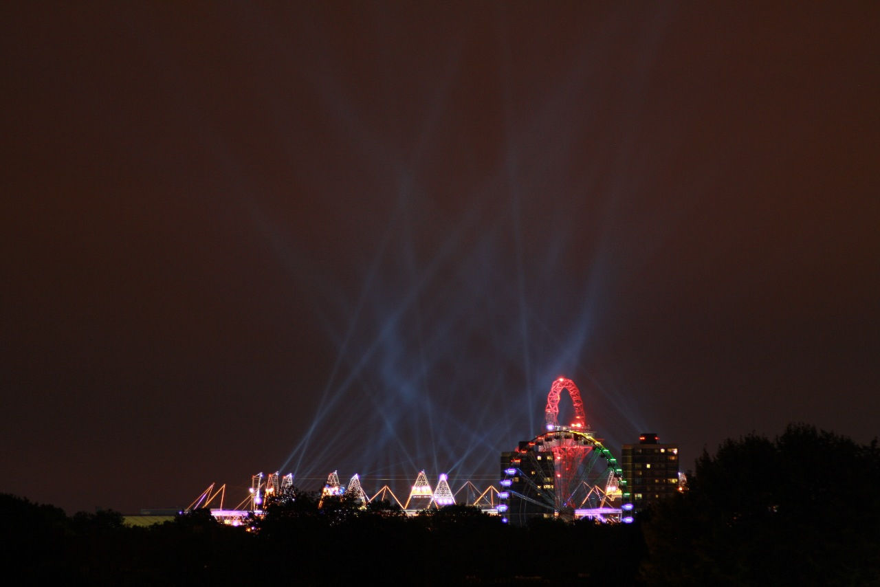 Amusement park ride lit up at night