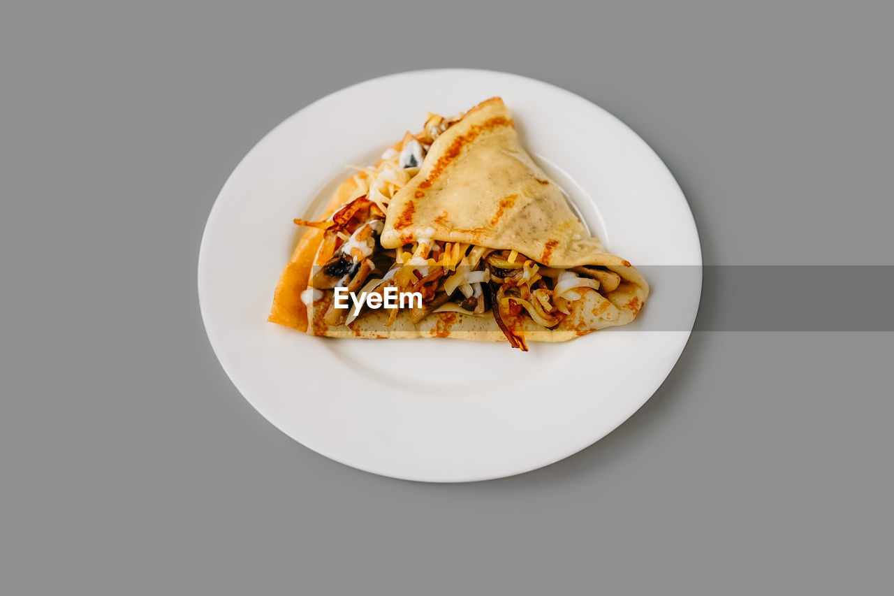 close-up of food in plate on white background