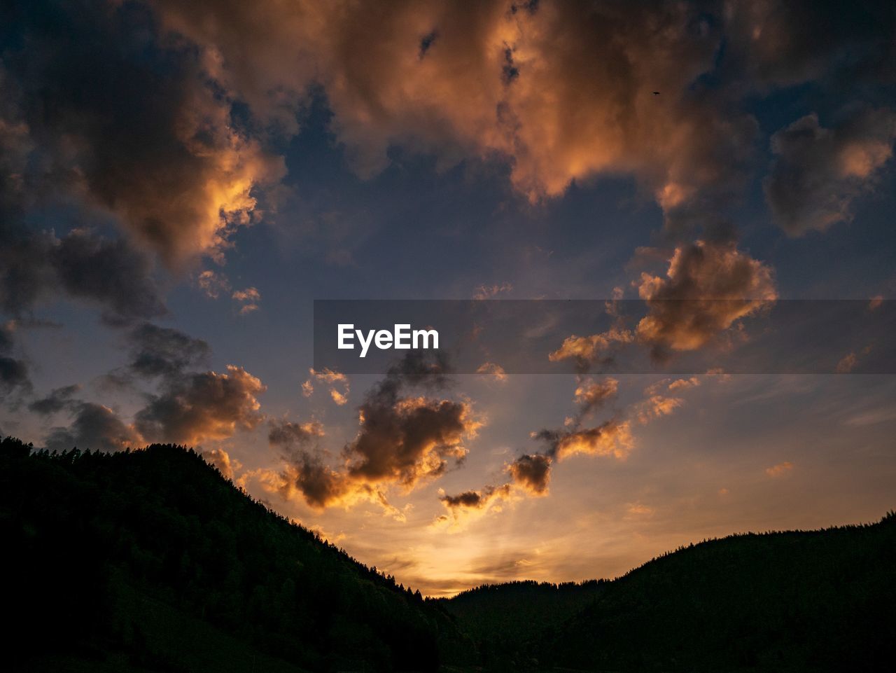 Scenic view of silhouette landscape against sky during sunset