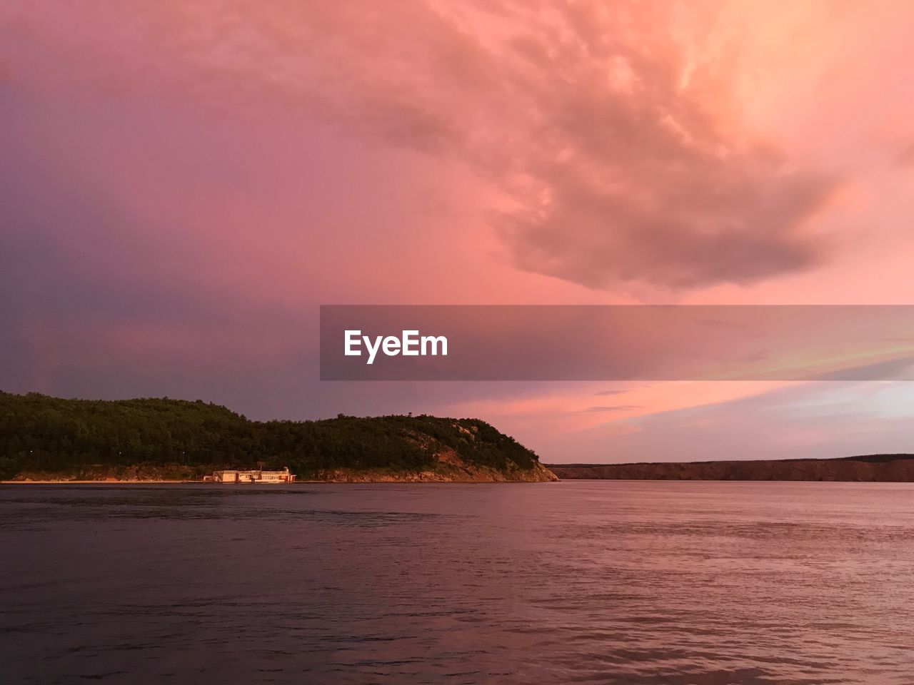 Scenic view of sea against sky at sunset