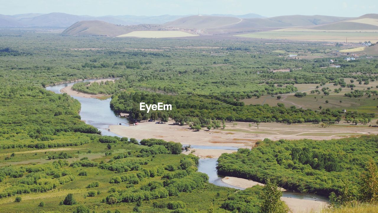 High angle view of river amidst landscape against sky