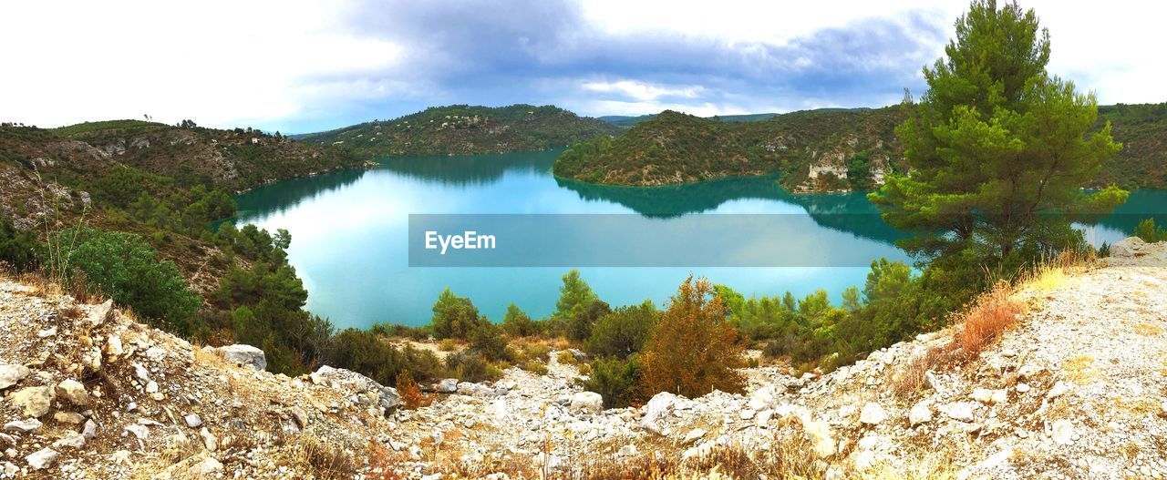 Panoramic view of trees and mountains against sky