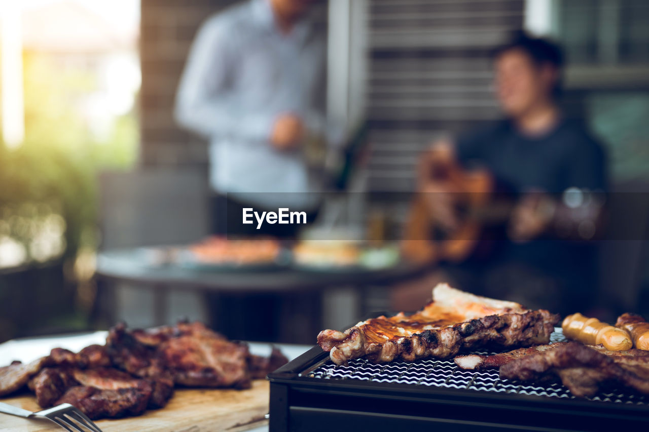 Meat on barbecue grill at market stall