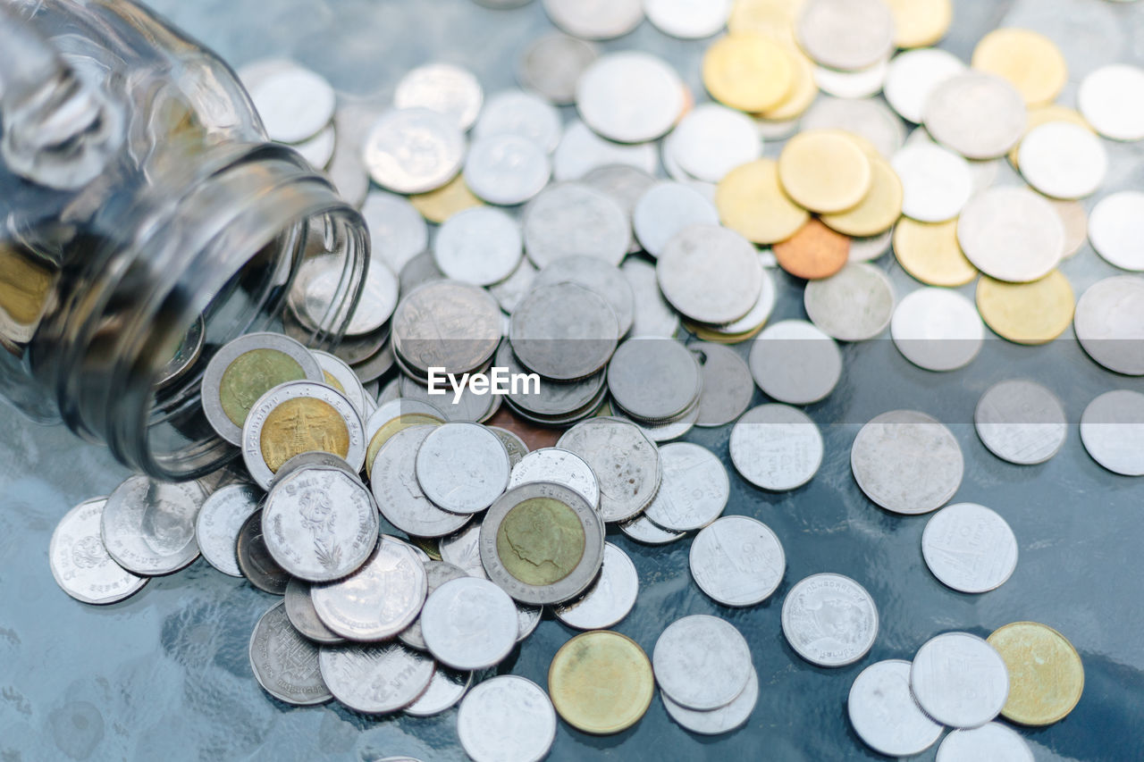 CLOSE-UP HIGH ANGLE VIEW OF COINS