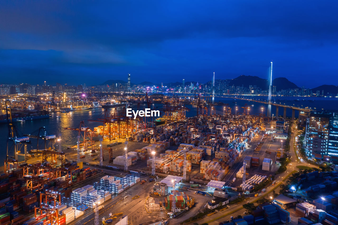 High angle view of city lit up at night