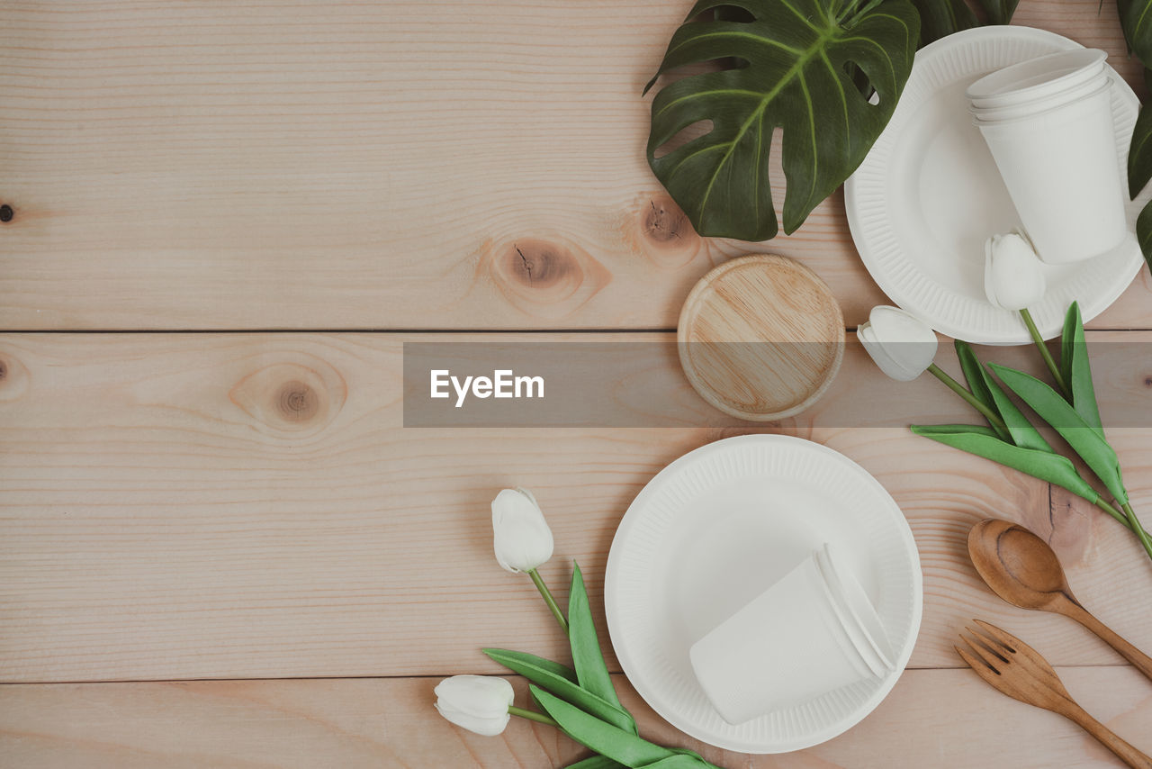 HIGH ANGLE VIEW OF VEGETABLES ON WOODEN TABLE