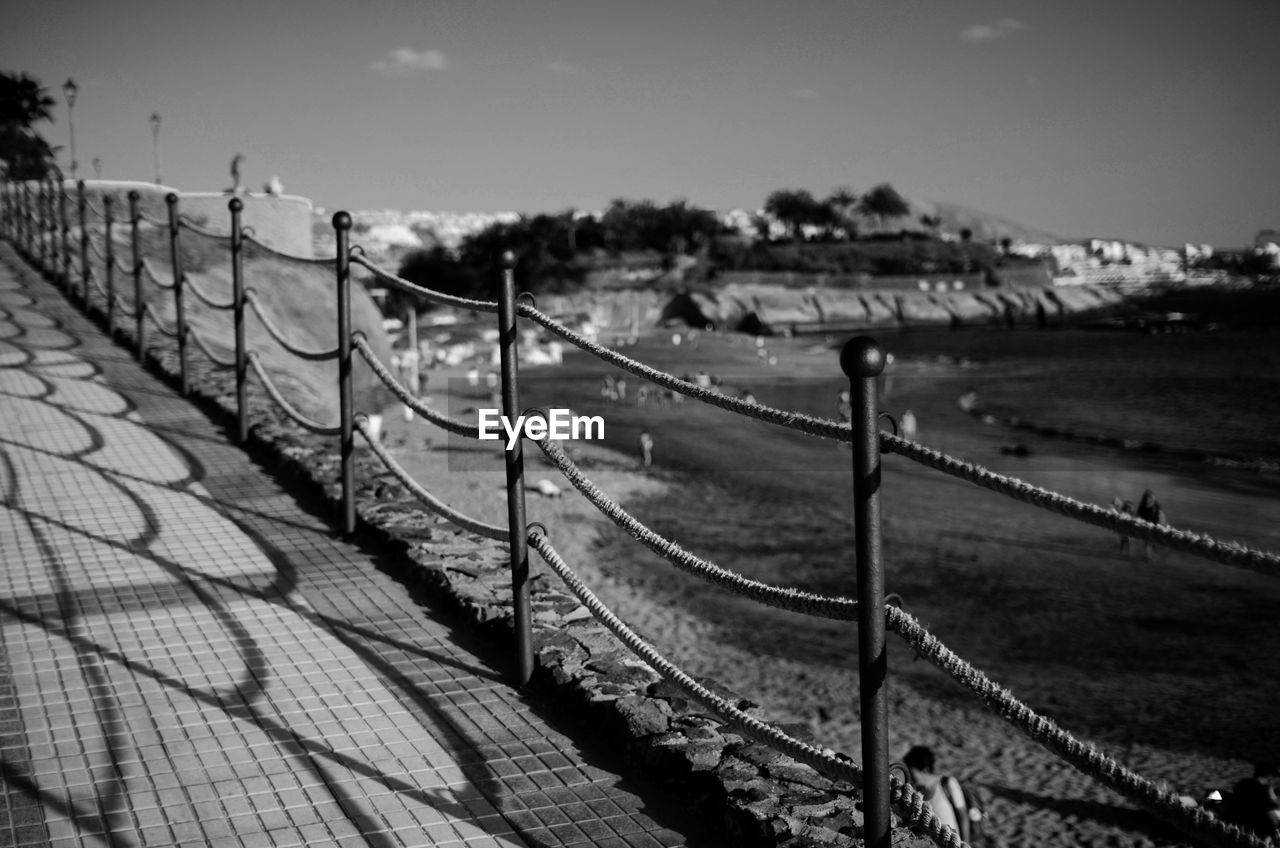 Close-up of railings against blurred landscape