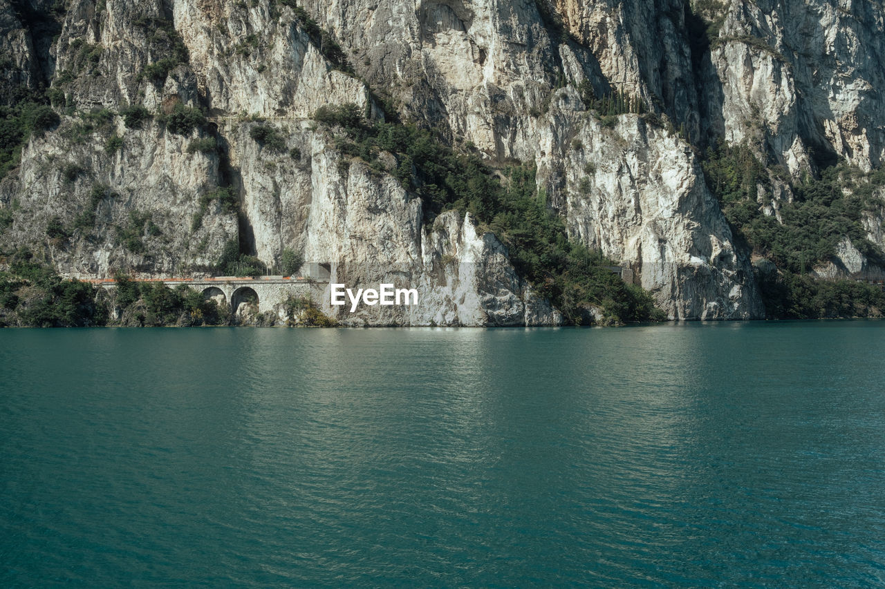 scenic view of sea against rock