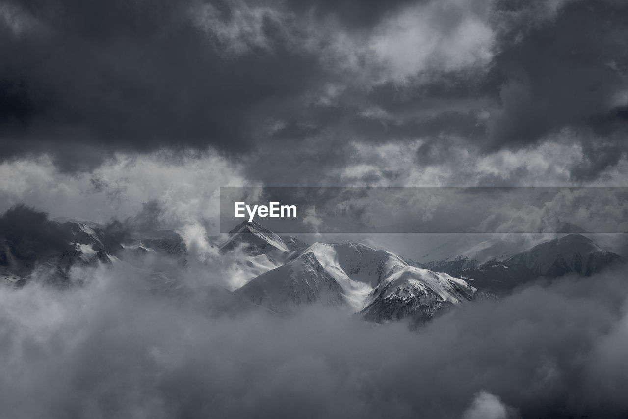 Scenic view of snowcapped mountains against sky