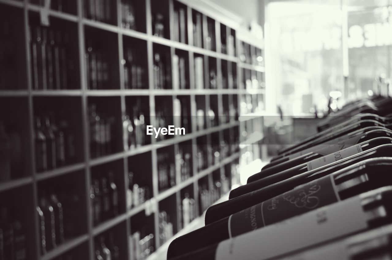 Wine bottles stacked in shelves