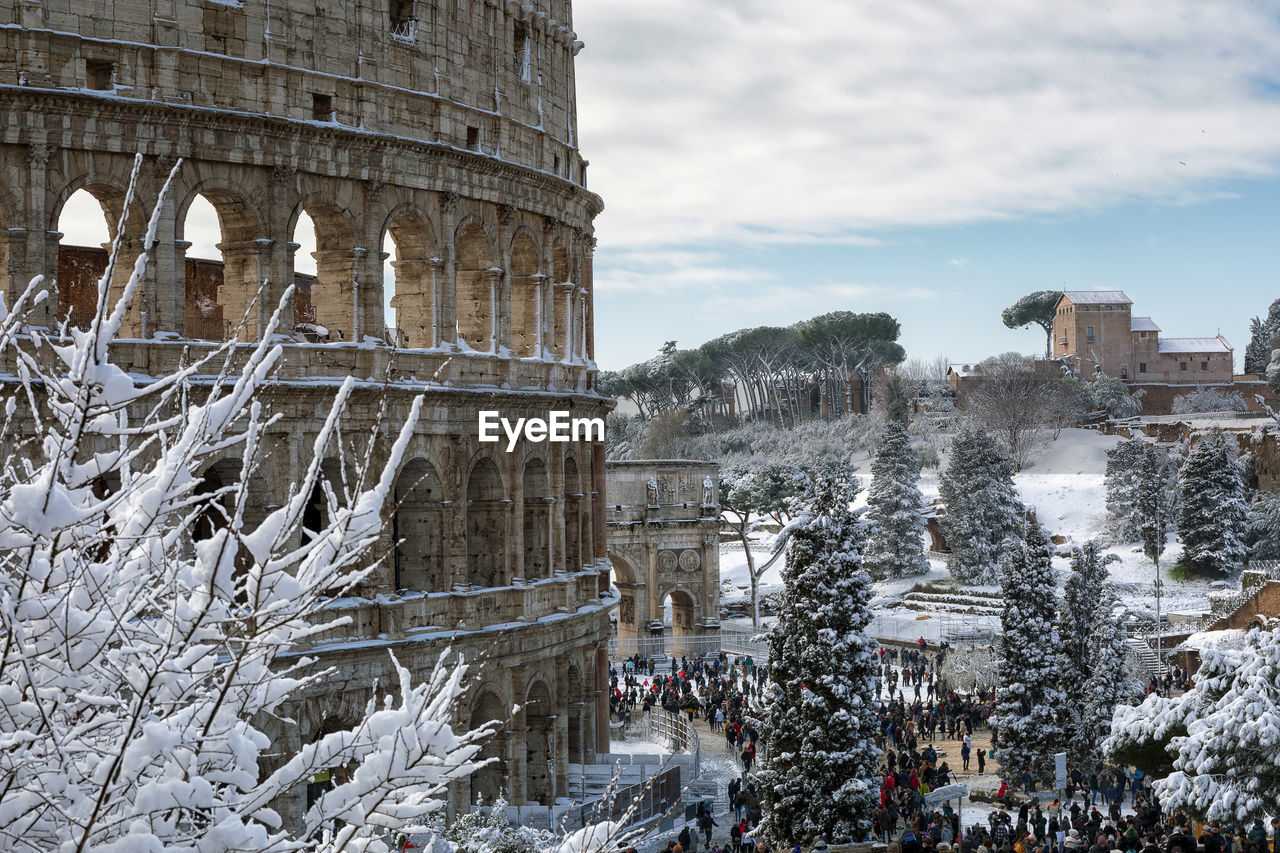 Coliseum against sky during winter