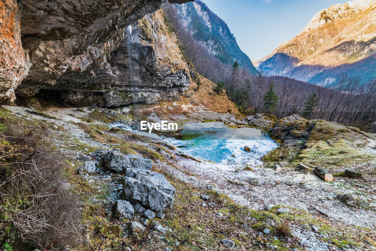 Winter. ice games in the fontanon of goriuda waterfall. friuli, italy.