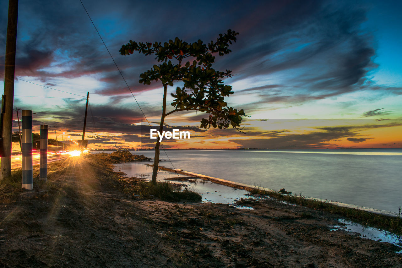 SCENIC VIEW OF SEA AGAINST ORANGE SKY