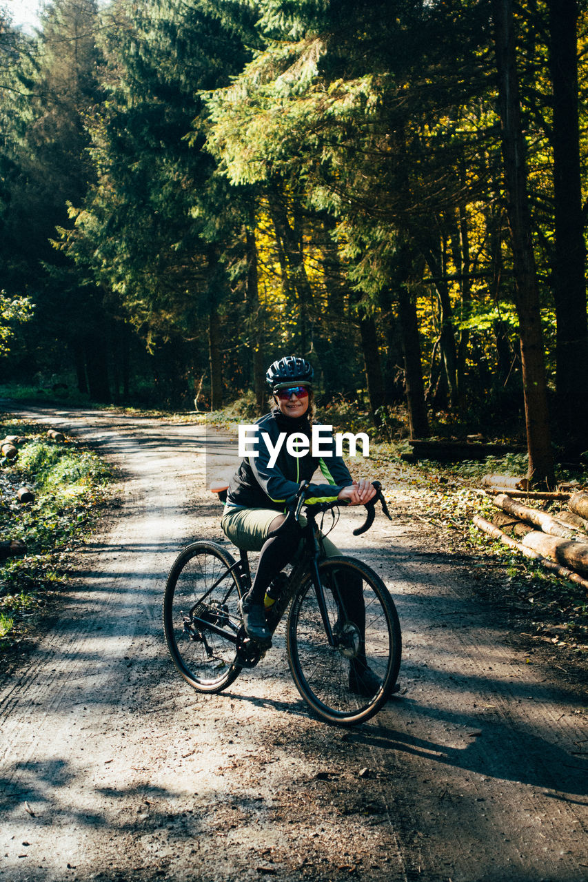 Portrait of a woman with a gravel bike