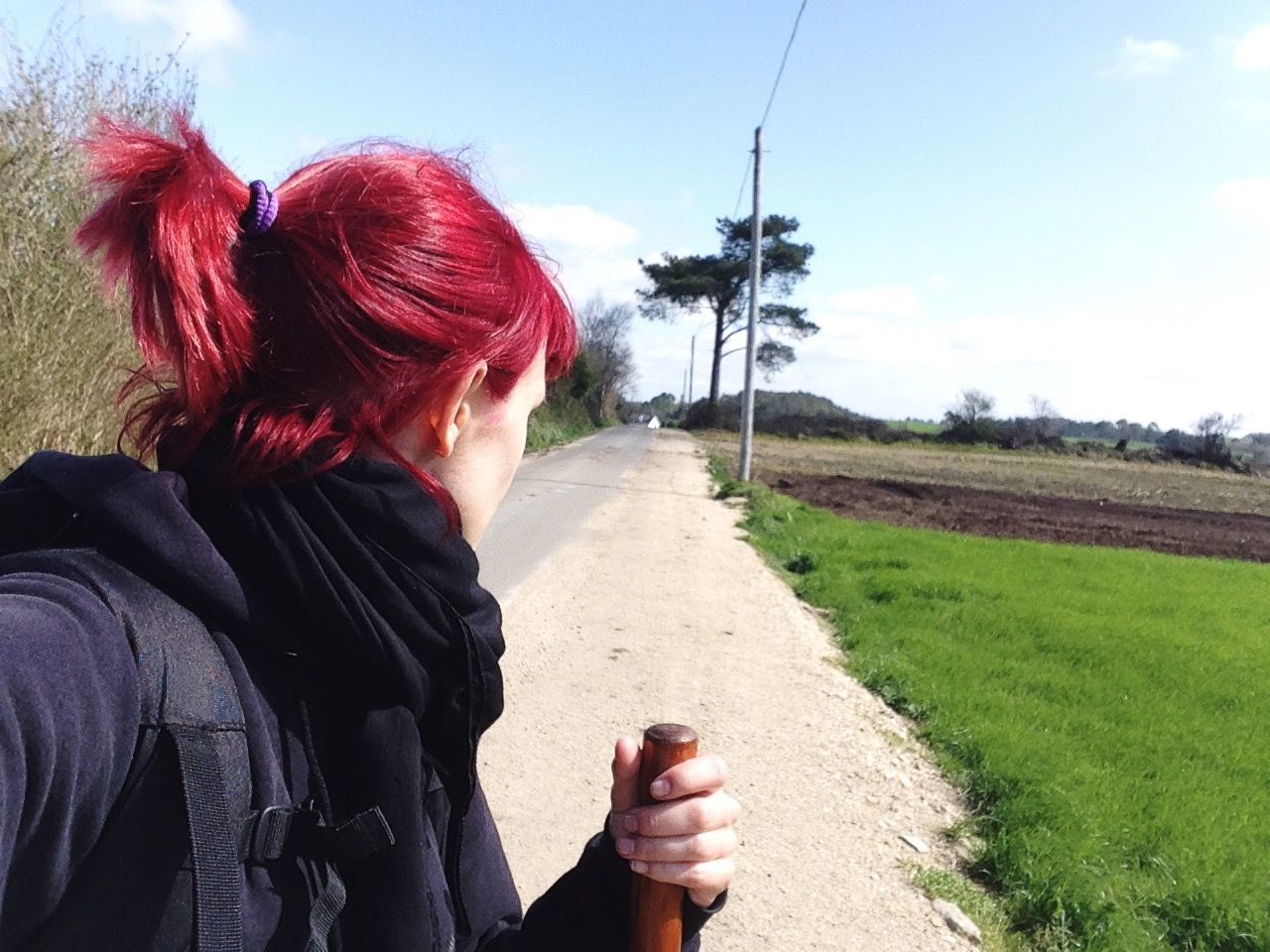 Side view of woman with dyed hair on field